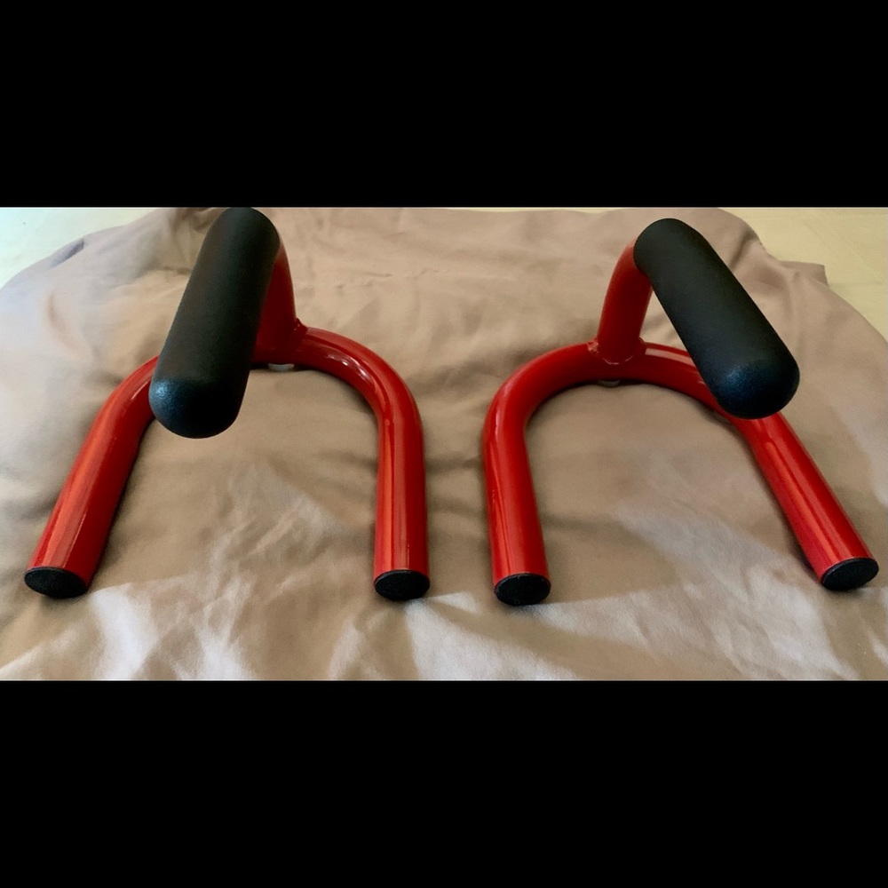 A set of new red metal push up grips